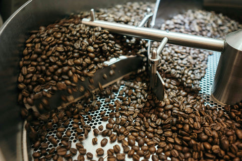Fresh coffee beans in a roasting machine