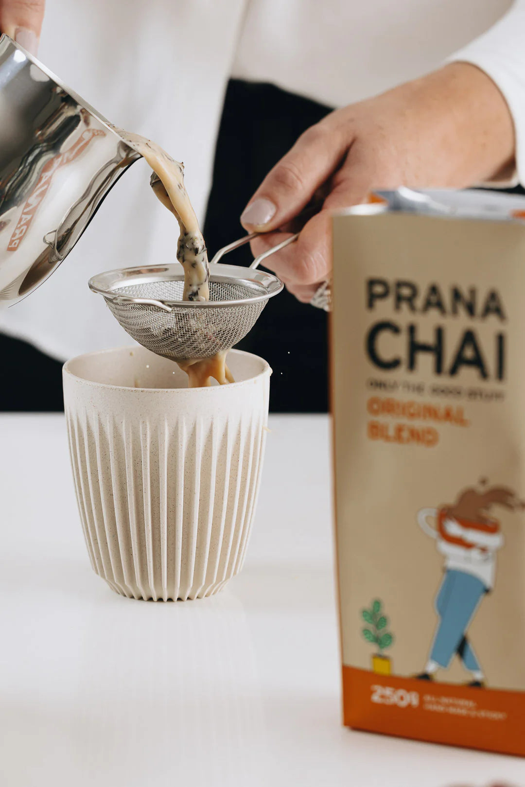 Prana Chai being poured in a cup